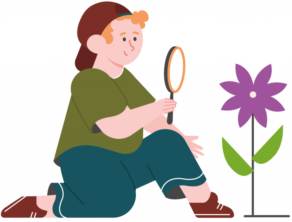 Young boy growing a flower and looking through magnifying glass