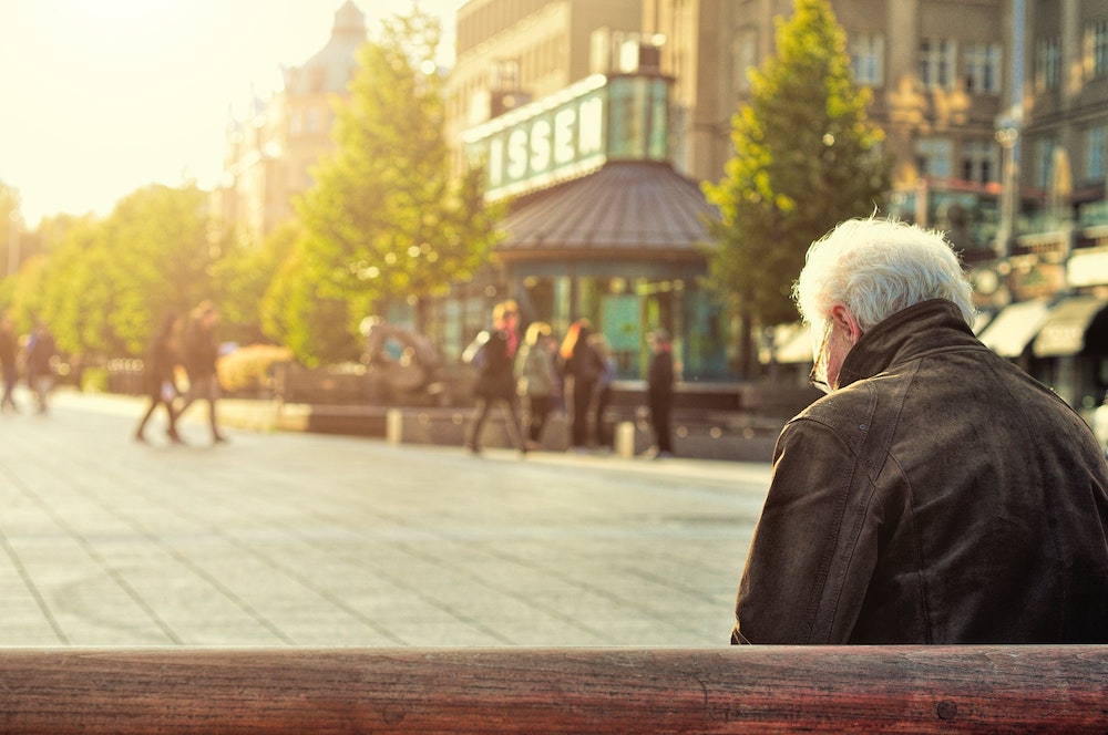 Older man sitting on a bench